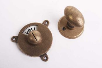 WC sluiting brons antiek met zwart-wit vrij-bezet plaatje en een kleine, ovale knop