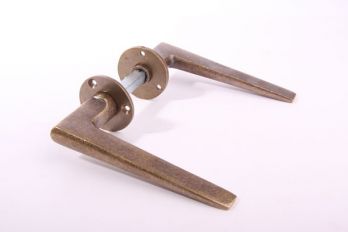 Deurklink per paar brons antiek Art Deco met ronde rozetten